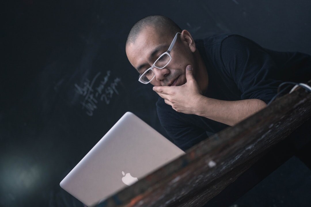 Friendly computer class teacher man smiling