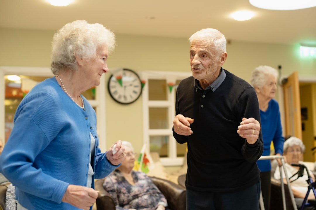 senior friends chatting warmly