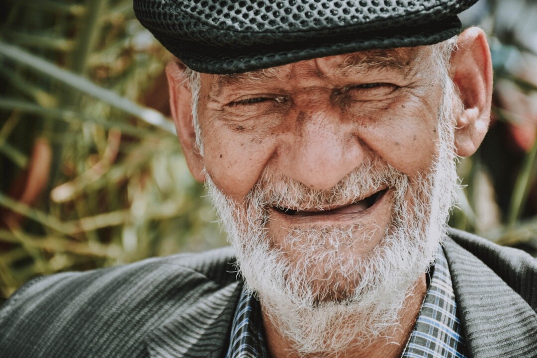Happy elderly man smiling warmly